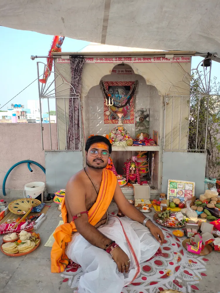 Purohit at a puja mandap